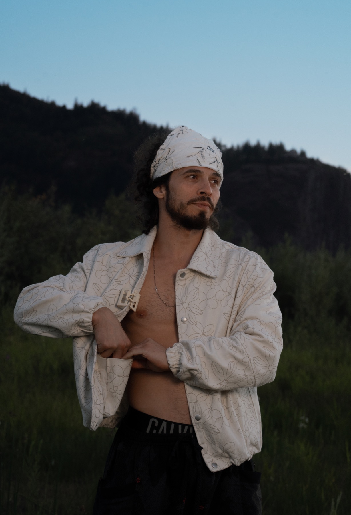 Feyyaz Chemen outdoors in a patterned white jacket