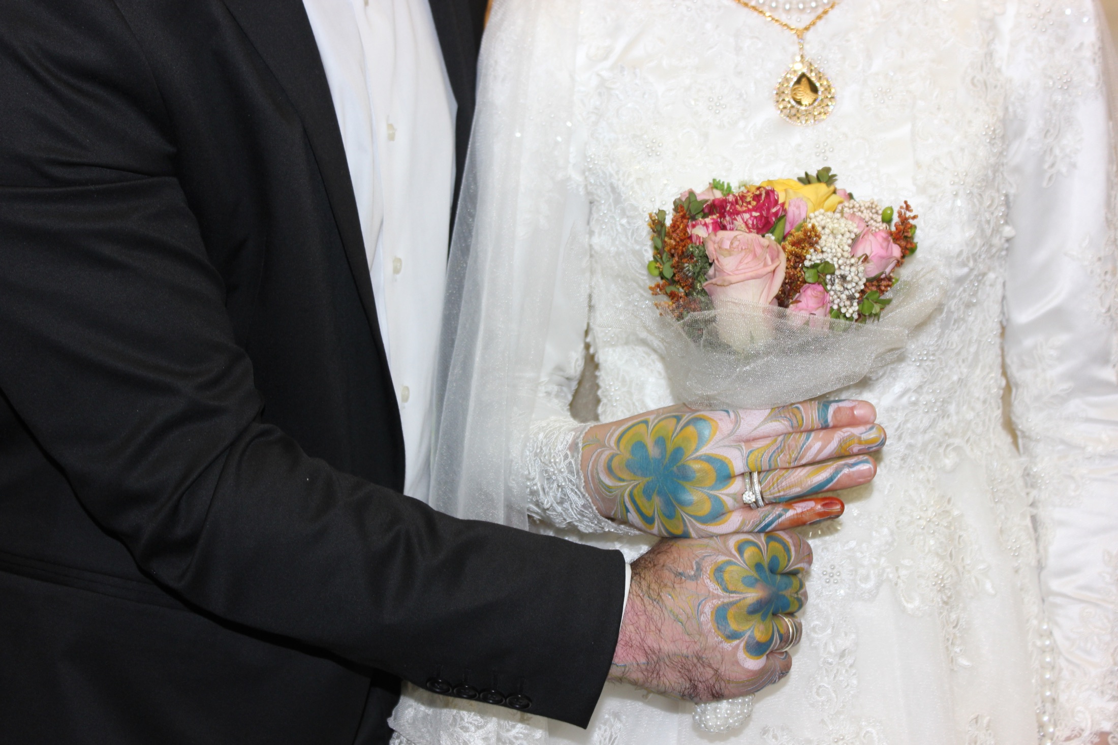Ebru marbling painted on hands during a ceremony